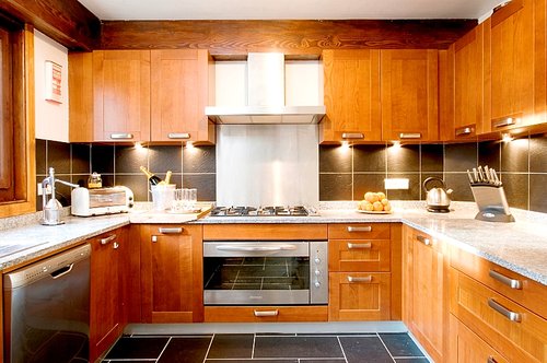 Well equipped kitchen off dining room