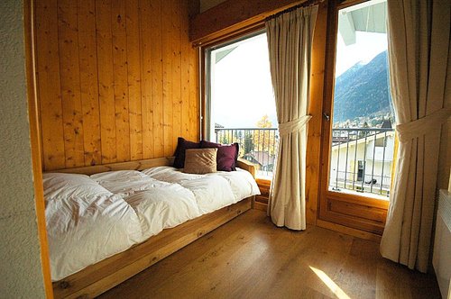Single bedroom opening onto balcony