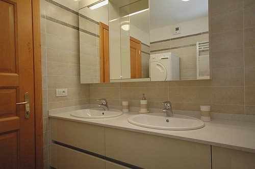 Bathroom with washing machine and dryer