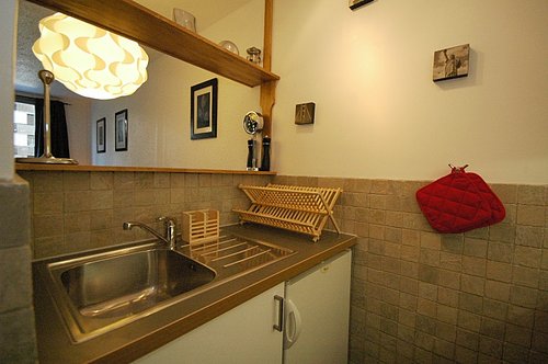 Kitchen behind living area