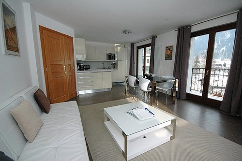 Open plan living area with glass doors onto Balcony