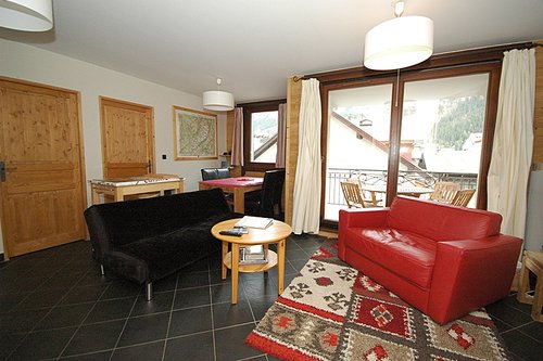 Open plan living area with balcony