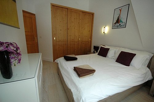Main bedroom with large storage cupboards