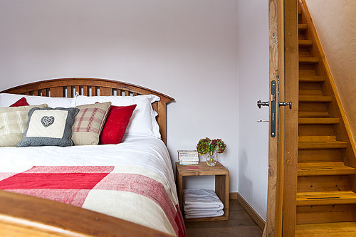 Bedroom 4 with stairs leading to mezzanine