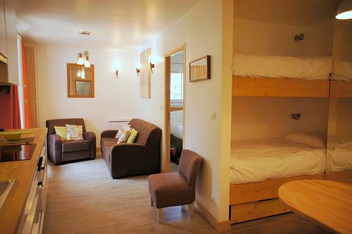 Bunkbeds in entry with wardrobe and storage