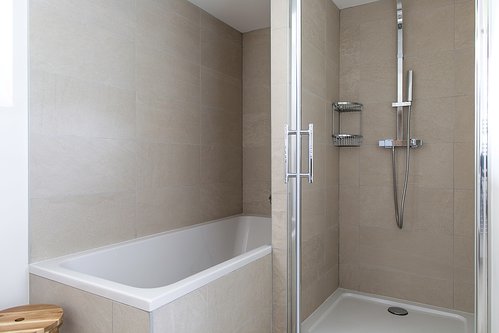 Shared bathroom with twin basins, shower and bath