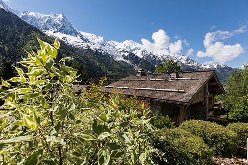 The exterior of Chalet Corbette from the beginning of the private heated driveway