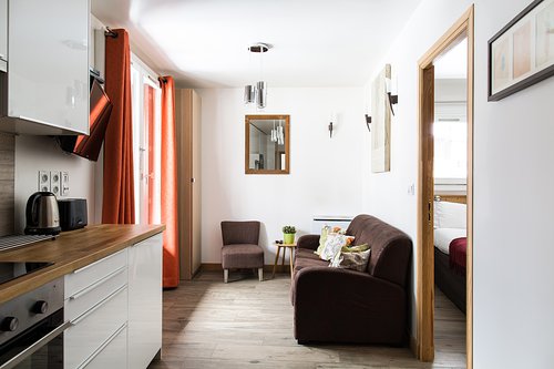 Living area with doors onto balcony