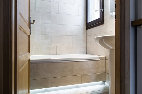 Bathroom with shower above bath (separate WC)