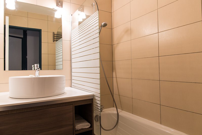 Bathroom with shower and bath