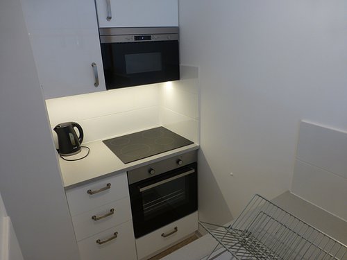 Newly refurbished kitchen with washing machine, hob, fridge, oven & microwave