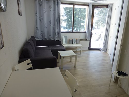 Living/dining area with doors to sunny terrace