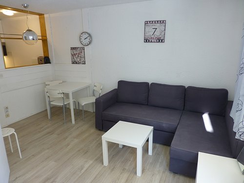 Living area with kitchen behind