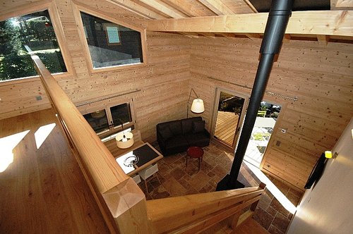 Large windows over looking mezzanine and living area