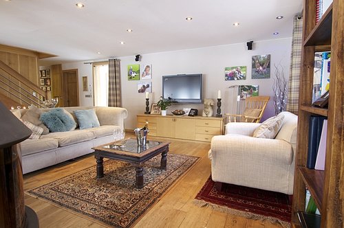 Comfortable lounge area with oak floors