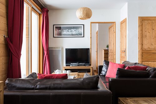 Sitting area with glass doors onto balcony