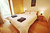 Double bedroom with ensuite shower room & door onto terrace