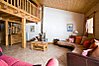 Open plan living area with mezzanine above