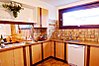 Kitchen with opening to dining area
