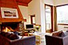 Living area with open fire and glass door to garden
