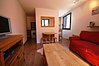 Open plan living area with kitchen to right